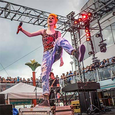 Massive open-air main deck stage concert under the stars on a Sixthman music cruise charter
